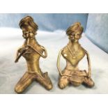 A pair of C20th Indian coiled wirework musicians, the turbaned moustachioed gentlemen seated cross-