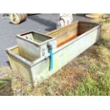 A rectangular 6ft galvanised trough with tubular rim, fitted with water supply box. (60.5in)