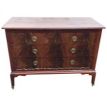 An Edwardian mahogany chest of drawers having rectangular top with channelled edge above three