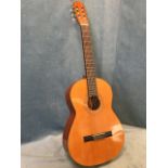 A Spanish guitar by Bespaña with cedar soundboard and ebonised fingerboard, having decoration