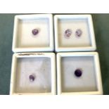 A boxed heart shaped Bolivian amethyst of approx 0.9 carats; a cased pair of oval pink amethysts