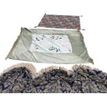 A tapestry style swagged pelmet woven with floral silver wreathes on blue ground with cord fringe;