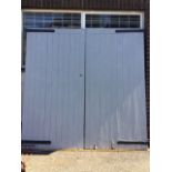 A pair large painted substantial garage doors of tongue & groove and Z-frame construction, fitted