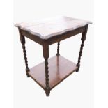 A rectangular oak scalloped top occasional table raised on barleytwist legs joined by platform