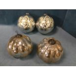 A pair of hanging silvered glass Kugel ornaments of fluted ball form; and another similar pair of
