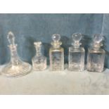 Three Edinburgh crystal square cut decanters with ball stoppers; a ships decanter with similar facet