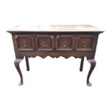 A small Georgian style oak dresser with rectangular moulded top above two panelled drawers -