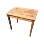 A nineteenth century beech school desk with hinged sloping lid, the compartment on square tapering