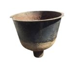 A large cast iron boiling pot with flat rim, the vessel with tubular base. (34in x 35in)