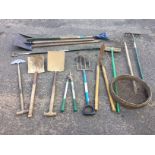 A quantity of garden tools - shovels, shears, rakes, a fork, a snow shovel, an edging spade, a