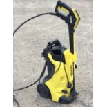 A Karcher K4 electric pressure washer.