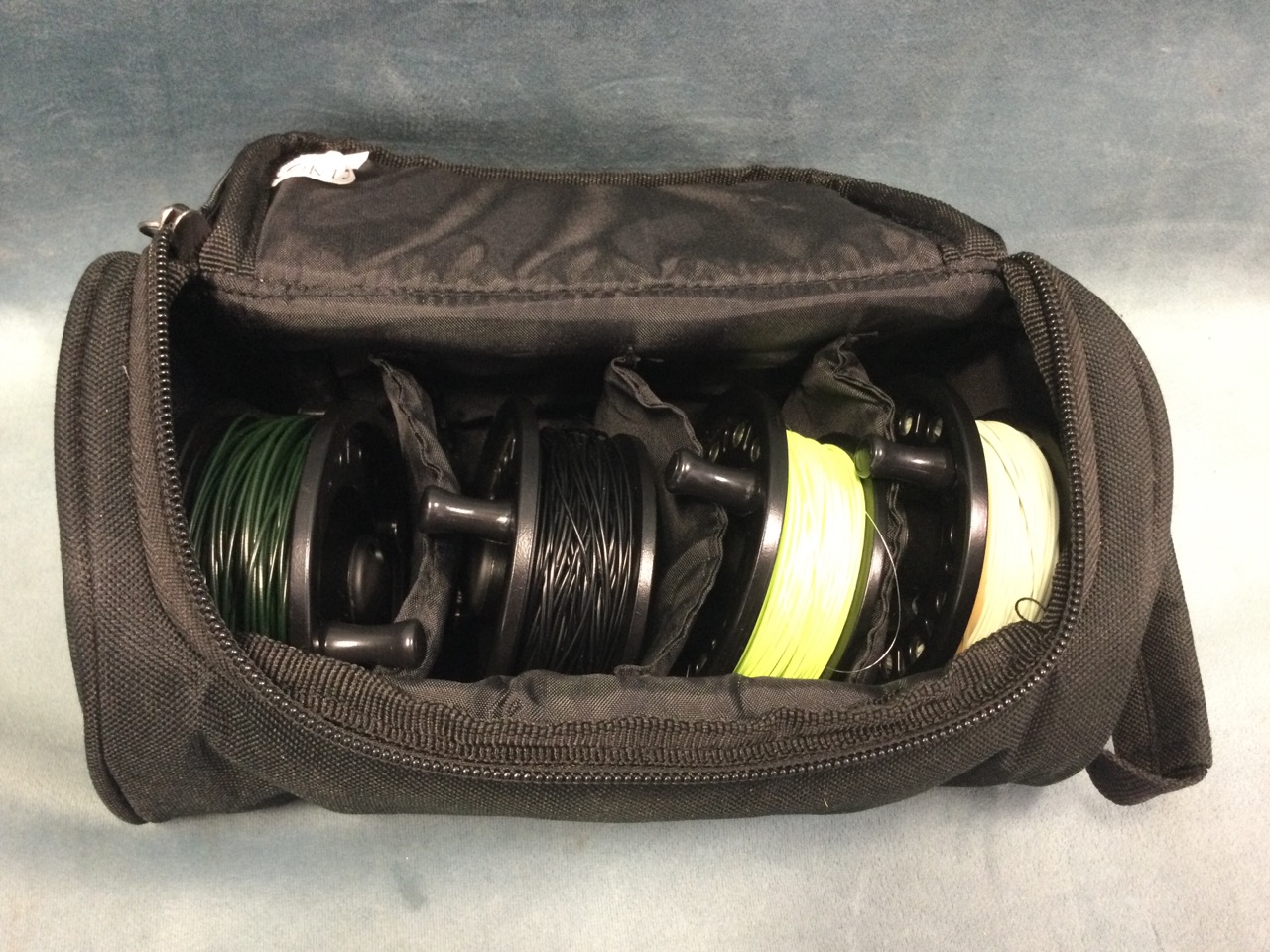 A 3.5in trout fly reel, and three interchangeable spools, in a Greys reel bag - four different - Image 3 of 3