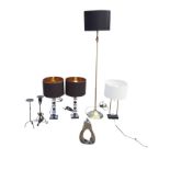 A pair of contemporary tablelamps with glass block columns and black & gilt shades; another