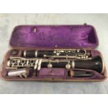 A C20th cased Italian hardwood clarinet. (26in)