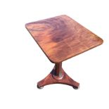 A nineteenth century style mahogany occasional table, with rectangular top on a tapering octagonal