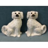 A pair of Victorian Staffordshire wally dogs with gilded brushwork decoration having gilt padlock