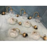 A set of seven unused Jim Lawrence wall lights in the Mia pattern with hand-blown fluted tear-drop