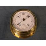 An Edwardian brass cased ships bulkhead barometer, the dial by JW Ray & Co of Liverpool under