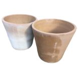 A pair of large tapering unglazed stoneware garden pots. (20in) (2)