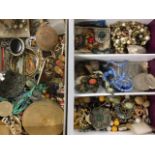 Miscellaneous jewellery including beads, brooches, some silver, a lighter, crayons, necklaces,