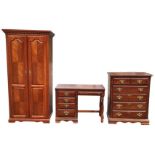 A reproduction mahogany bedroom suite with chest of drawers, panelled door wardrobe and dressing