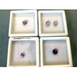 A boxed heart shaped loose Bolivian amethyst of approx 0.9 carats; a cased pair of oval pink