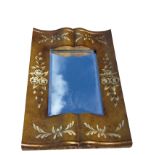A rectangular bevelled mirror in cushion shaped frame painted with flowers & foliage on scumbled