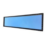 A long rectangular mirror in gesso leaf scrolled frame. (49.25in x 13.5in)