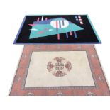 A modern rug woven with abstract geometric shapes on black ground within a blue border - 76.5in x