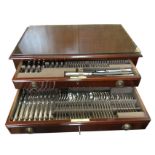 A mahogany cased canteen of Mappin & Webb silver plated cutlery, the eight settings with beaded
