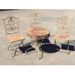 A garden table & chair set, the three folding chairs with panelled seats having scrolled wrought