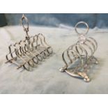 An Edwardian silver plated four-division toastrack raised on bun feet with ring handle, having