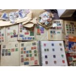 A schoolboy stamp collection contained in five albums, loose envelopes of stamps, checklist