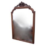 A Victorian mahogany framed mirror, the moulded frame with pierced scroll carved crest. (20in x 32.