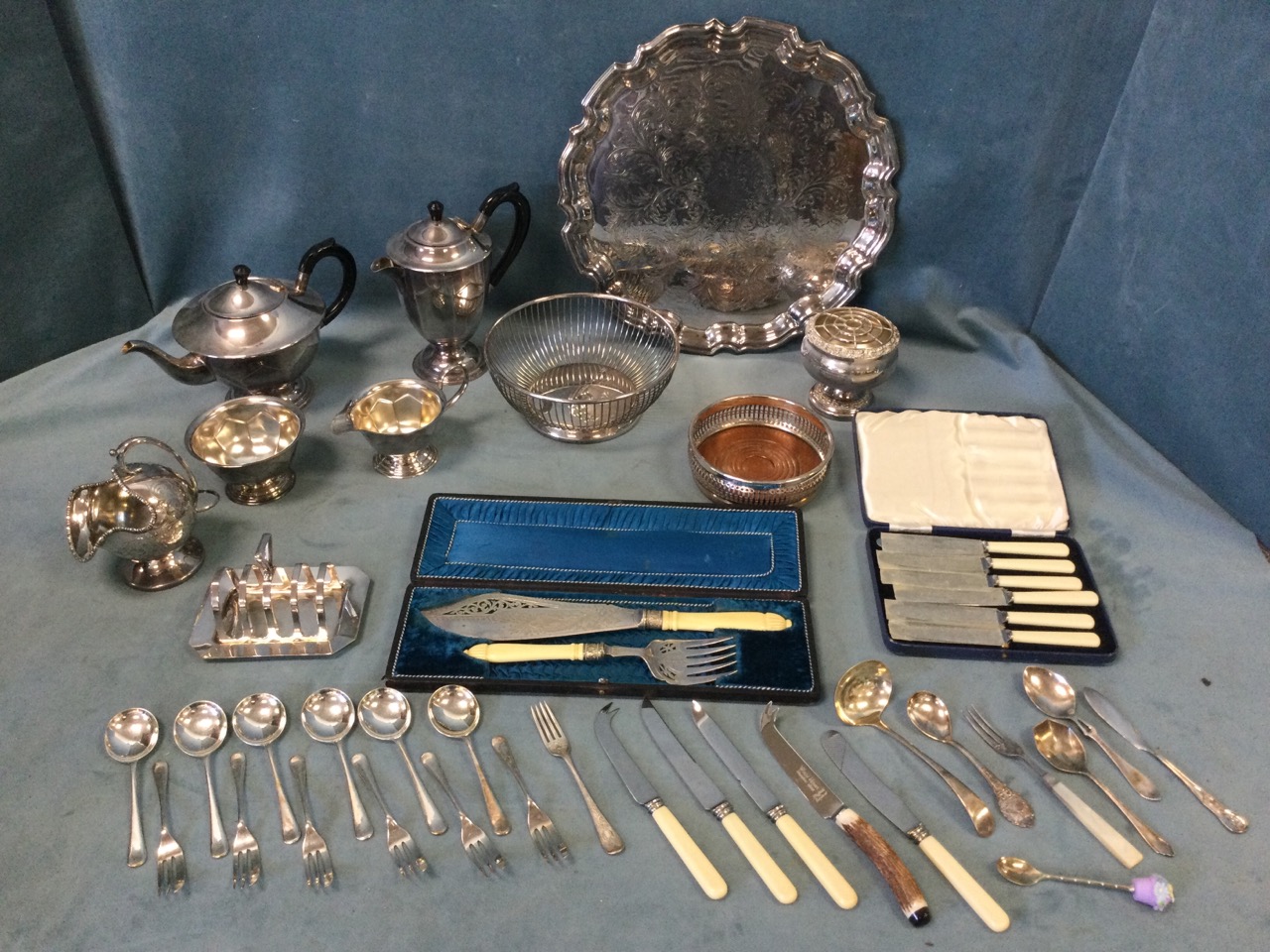 Miscellaneous silver plate including cased servers, a four-piece teaset, a coaster, a Viners