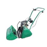 A Qualcast classic petrol 43s lawn mower with grass box. A/F.