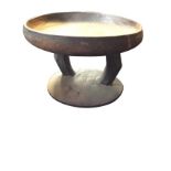 A large carved hardwood bowl on stand with two chamfered supports on circular moulded plinth. (19.