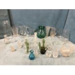 A quantity of glass vases & jugs including a set of bulb vases, graduated jugs, cut vases, a water