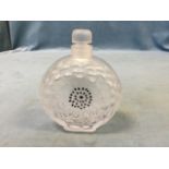 A Lalique glass scent bottle & stopper moulded as a flowerhead on rectangular rounded plinth, with