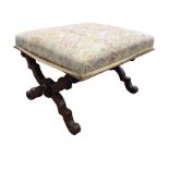 A Victorian rosewood stool with rectangular upholstered seat supported on crossed shaped legs