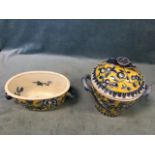 Three decorative glazed pots decorated with blue flowers on yellow ground - ovoid with pomegranate