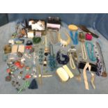 A box of miscellaneous costume jewellery, fashion belts, brushes, brooches, cuff-links, earrings,