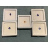 Four boxed fissure filled blue sapphires; and a trillion-cut yellow sapphire; approx 4.5 carats in