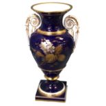 A classical Meissen porcelain vase with scrolled gilded handles painted with gilt and silvered