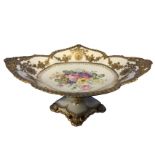 A Royal Crown Derby comport painted with a bouquet of flowers framed by gilded border, with