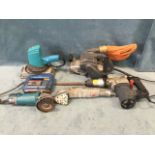 An Elu belt sander; a Wolf grinder and sander; a Bosch jigsaw; and a Performance Power rotary hammer