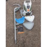 An unused Vax steam cleaner, complete with instruction leaflet, attachments, cane, hose,
