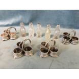 A hallmarked silver cruet stand with beaded decoration to handle and rims of the three pots, on