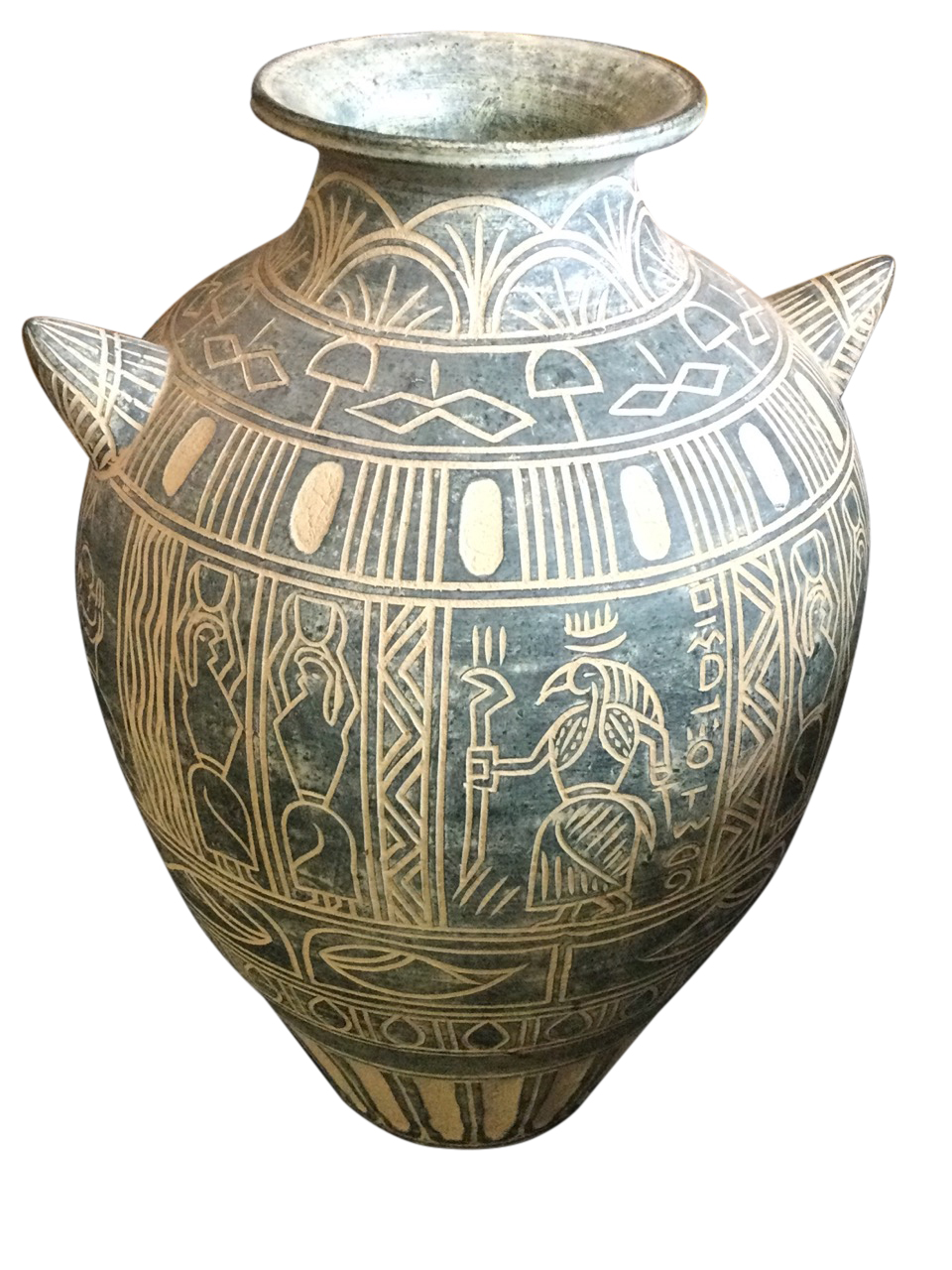 A large Mexican terracotta vase with incised sgraffito decoration, having stylised figural frieze