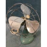 A 1950s H Frost & Co electric fan with aluminium blades in chromed cage on an adjustable weighted